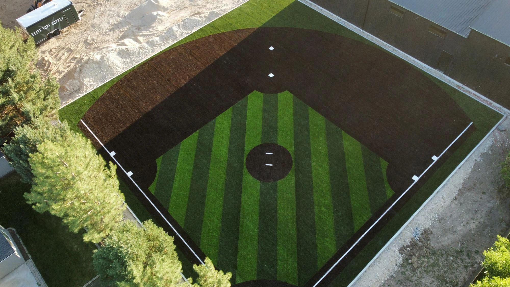 Backyard turf baseball field at a residence